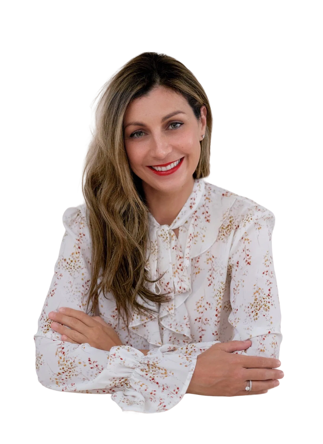 Woman in floral blouse with arms crossed